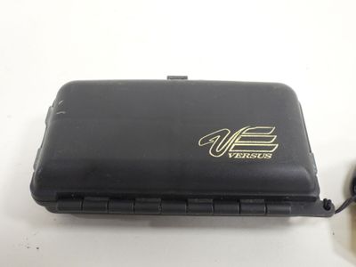 a black case with a gold logo on it