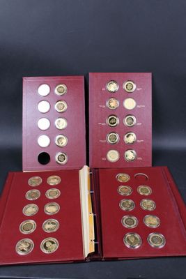 two red folders with gold and silver coins in them