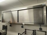 a kitchen with stainless steel cabinets and sinks in it