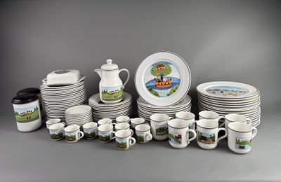 a lot of plates and cups that are sitting on a table