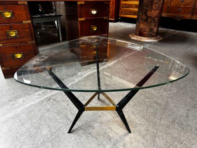 a glass table with a metal base and a glass top