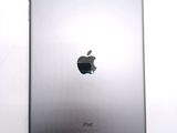 an apple ipad sitting on top of a white table next to a white wall