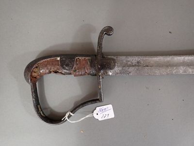 a very old looking sword with a tag on it