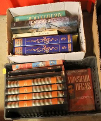 a box full of books sitting on the floor