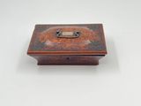 an old wooden box with a metal latch on it