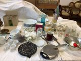 a table that has a lot of dishes and cups on it