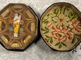 two decorative boxes with a picture of a woman on them