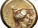a gold coin with a woman ' s head on it
