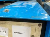 a machine that is sitting on a table in a warehouse