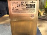 a metal box with a label on it sitting on top of a table