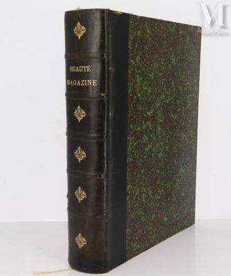 an old book sitting on top of a table next to a white wall