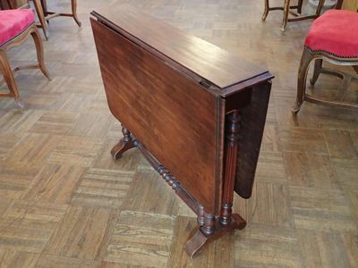 a small table that is sitting on a wooden floor