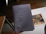 a person holding a piece of paper with a picture on it