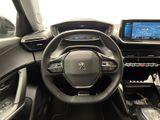 the interior of a car with a steering wheel, dashboard, and touch screen