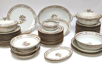 a lot of plates and bowls on the table
