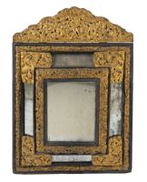 MIROIR EN CUIVRE REPOUSSÉ ET ÉBÈNE