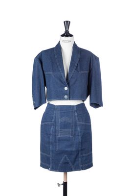 denim skirt suit on a mannequin base with a jacket