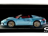 a blue toy car in a black box on a white background