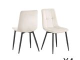 pair of white leather dining chairs with black legs