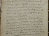 an old book with writing on it sitting on top of a table