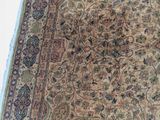 a carpet with a large floral design on it