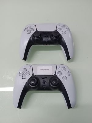two video game controllers that are sitting on a table