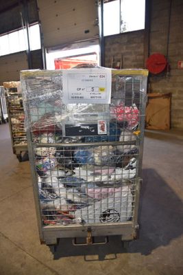 a cart with a lot of items in it in a warehouse