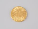 an image of a close up of a gold coin on a white surface