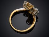 a close up of a diamond ring on a black surface