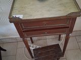 a small table with a bowl on top of it