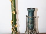 two vases that are sitting on a table
