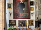 a painting on the wall above a table in a living room