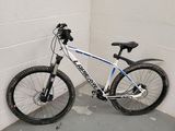 a bike that is leaning against a wall in a garage