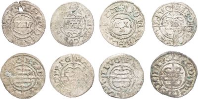 a group of six silver coins with different designs on them