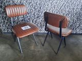 two chairs sitting next to each other in a room