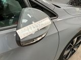 a sticker on the side mirror of a car