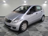 a picture of a silver car parked in a garage