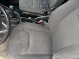 the interior of a car with a steering wheel and a steering control