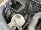 a car engine with the hood up and the hood down