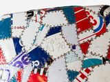 a piece of luggage that is covered in stickers