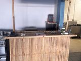 a bamboo bar in the middle of a kitchen