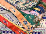 a pile of assorted pieces of cloth on a table