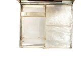 a silver box with a mirror on top of it