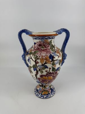 an image of a vase with flowers and birds on it