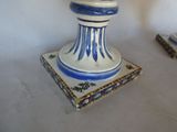 a blue and white vase sitting on top of a table