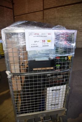 a metal cart with a bunch of boxes on top of it