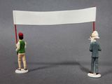 two figurines that are holding a white flag