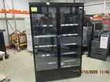 a refrigerator that is sitting in the middle of a room