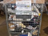 a metal cart with many items in it in a warehouse