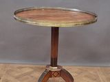 an image of a wooden table with a metal top on a wooden floor